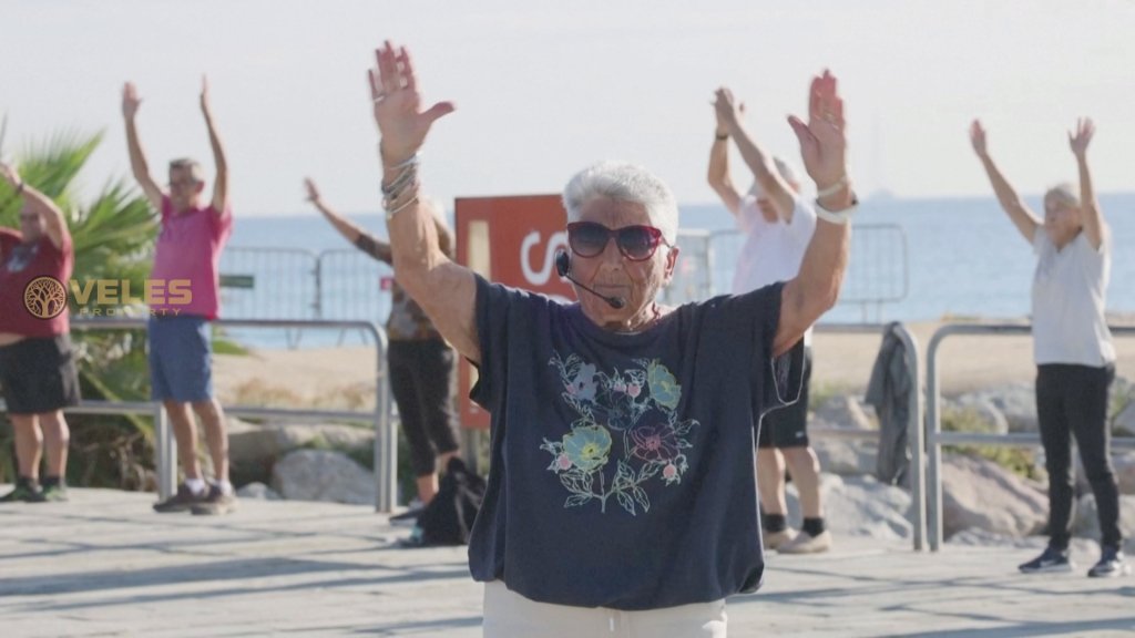 A senior Spaniard lady leads daily fitness classes