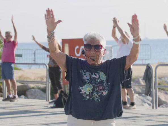 A senior Spaniard lady leads daily fitness classes